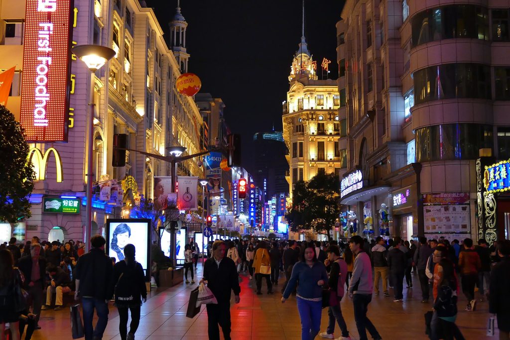 Nanjing Road pedestrian street in Shanghai at night with illuminated signs