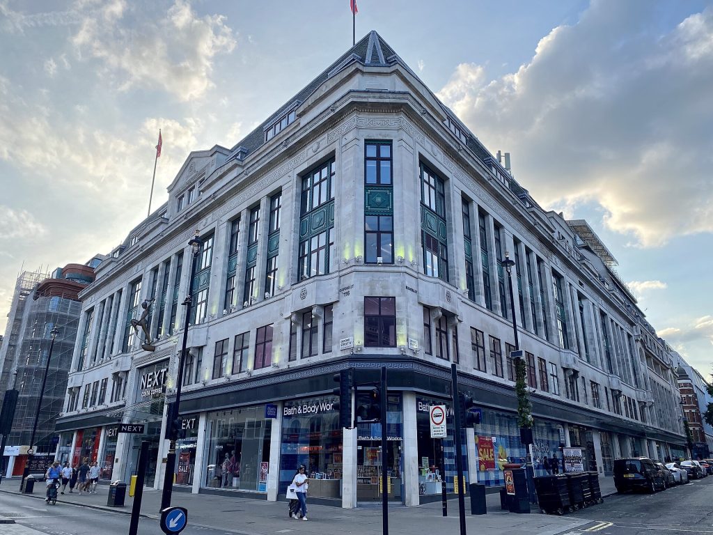 Corner of Oxford Street in London with Next and Bath & Body Works shopfronts